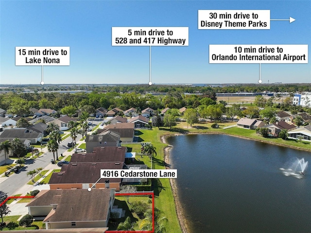 birds eye view of property with a residential view and a water view