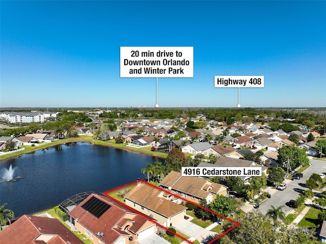 bird's eye view with a residential view and a water view