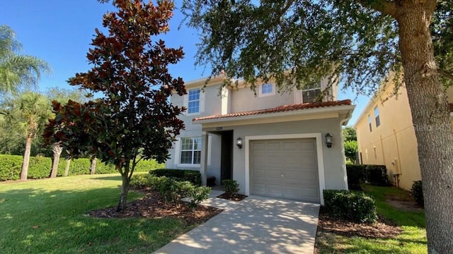 view of front facade featuring a front yard, stucco siding, concrete driveway, a garage, and a tile roof