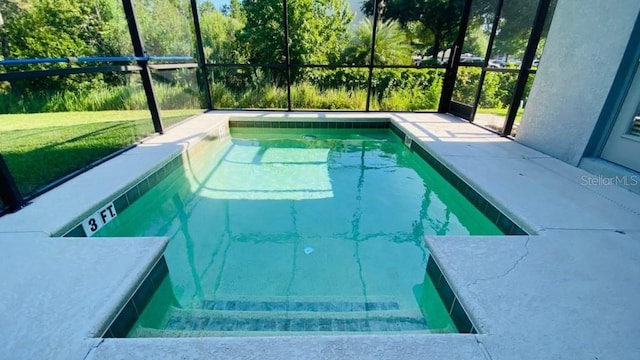 outdoor pool featuring glass enclosure and a yard