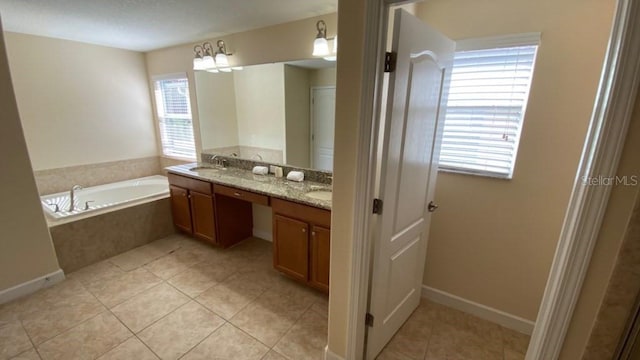 full bathroom featuring tile patterned flooring, a garden tub, double vanity, and a sink