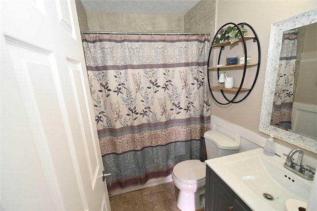 bathroom with tile patterned floors, curtained shower, toilet, and vanity