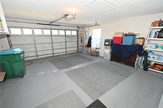 garage featuring electric panel and a garage door opener