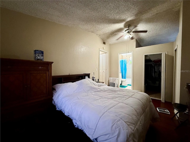 bedroom featuring a textured ceiling, visible vents, a ceiling fan, a closet, and ensuite bath