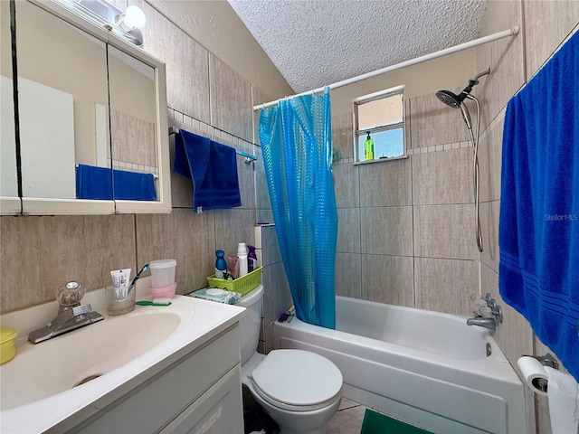 bathroom featuring shower / tub combo, toilet, a textured ceiling, and vanity