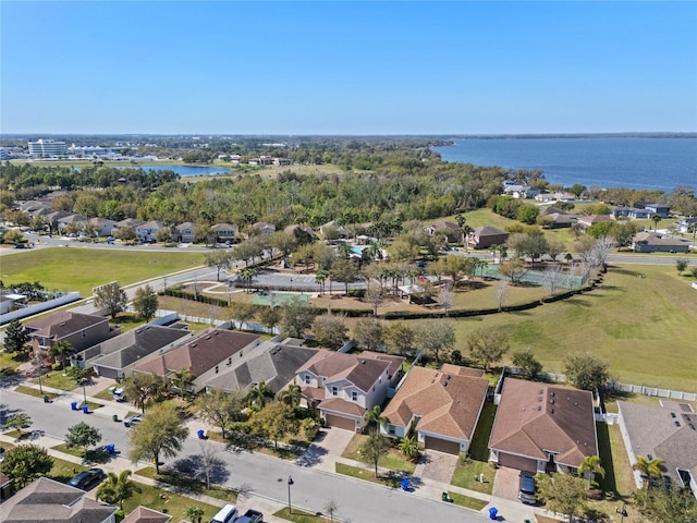 drone / aerial view with a residential view and a water view