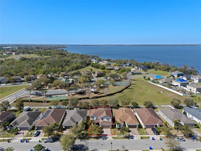 bird's eye view with a residential view and a water view