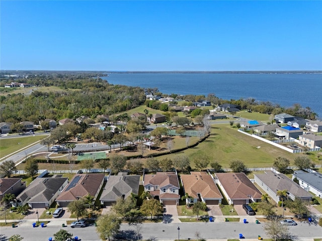 bird's eye view featuring a residential view and a water view