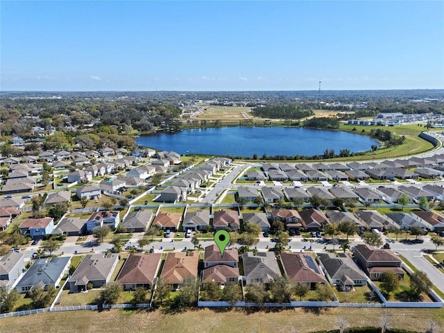 bird's eye view with a residential view and a water view