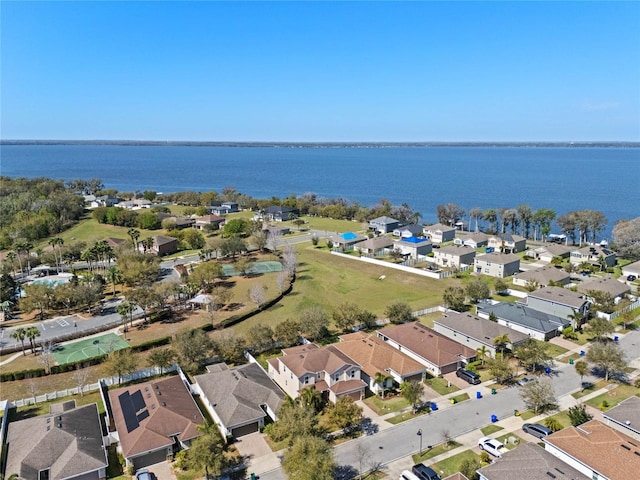 drone / aerial view featuring a residential view and a water view