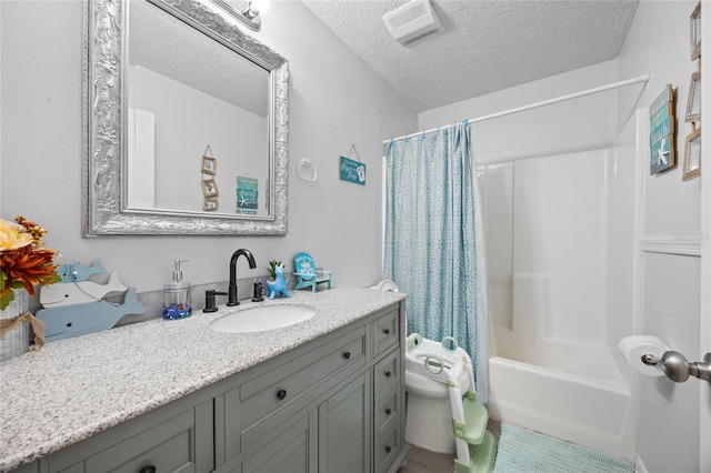 bathroom with shower / tub combo with curtain, visible vents, toilet, a textured ceiling, and vanity