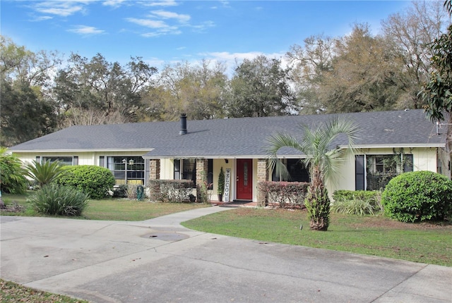 ranch-style house with a front lawn