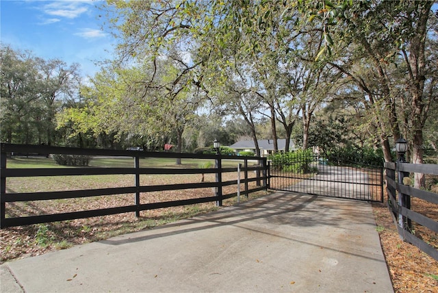 view of gate with fence