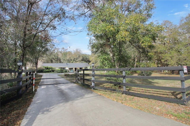 view of gate featuring fence