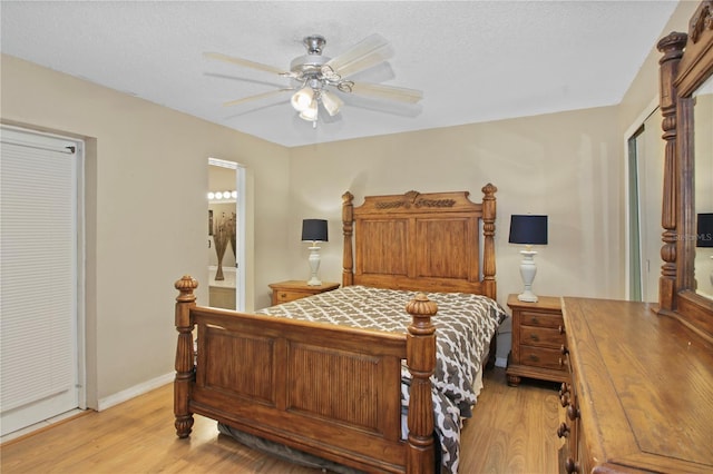 bedroom with a textured ceiling, ceiling fan, light wood-style flooring, and baseboards