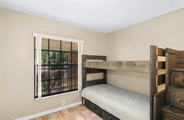 bedroom featuring baseboards