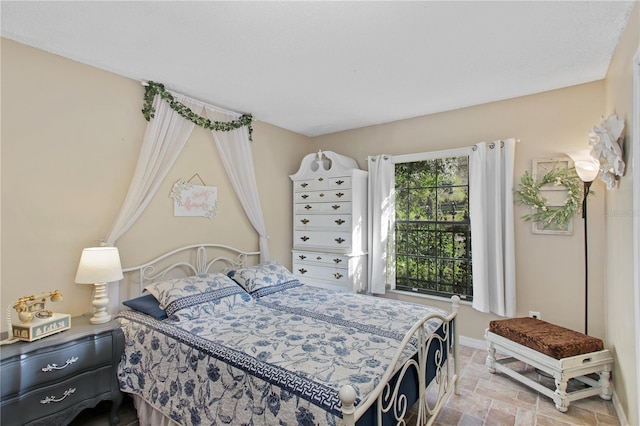 bedroom featuring baseboards