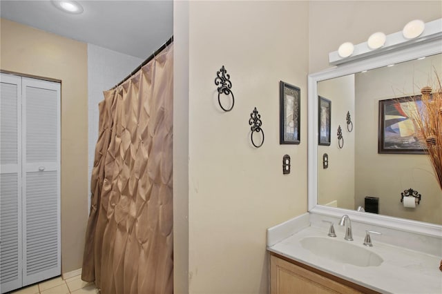 full bath featuring vanity and tile patterned floors