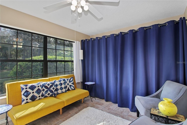 living area featuring ceiling fan