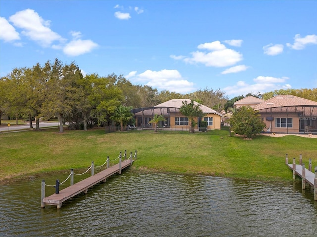 dock area featuring a lanai, a lawn, and a water view