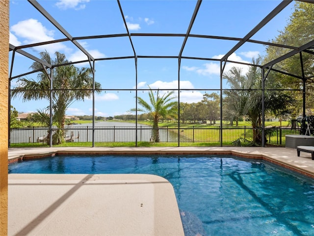 view of swimming pool with a patio area, glass enclosure, a fenced in pool, and fence