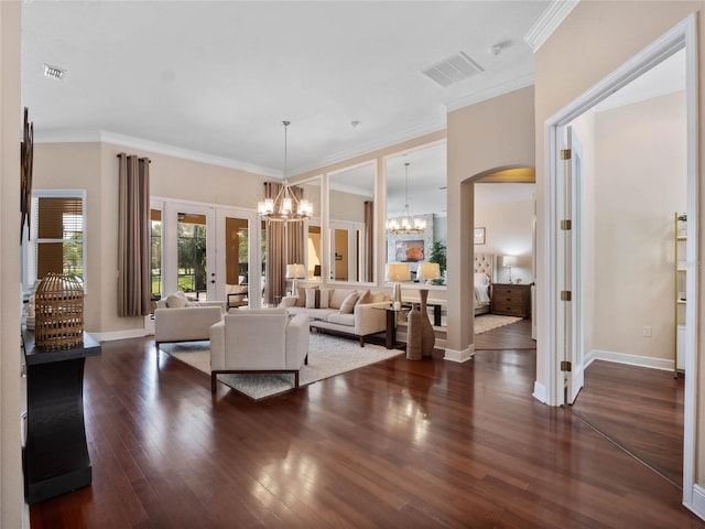 living room with visible vents, baseboards, french doors, an inviting chandelier, and wood finished floors