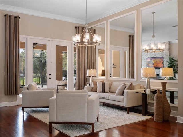 living area with an inviting chandelier, dark wood-style floors, and crown molding