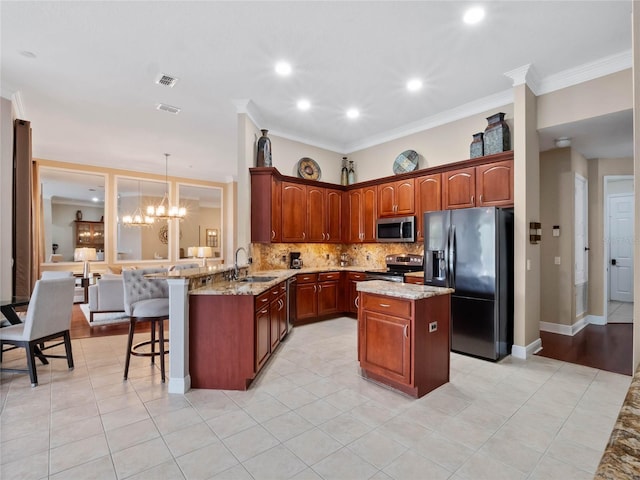 kitchen featuring tasteful backsplash, a center island, a breakfast bar, a peninsula, and stainless steel appliances