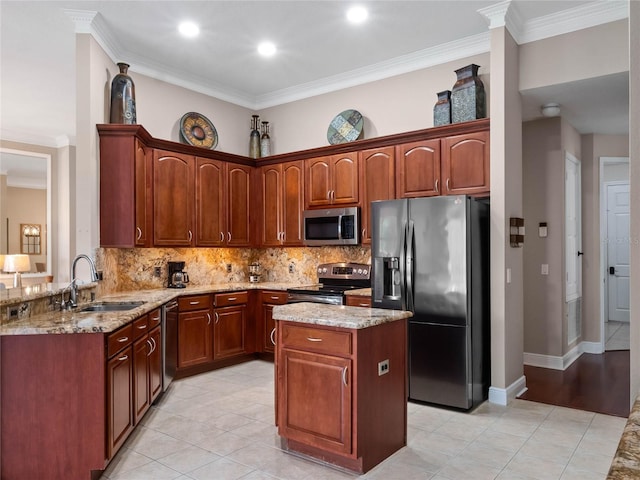 kitchen with a sink, stainless steel appliances, light stone countertops, and tasteful backsplash