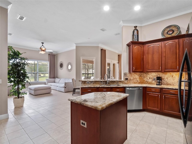 kitchen with a sink, visible vents, stainless steel dishwasher, and light tile patterned flooring