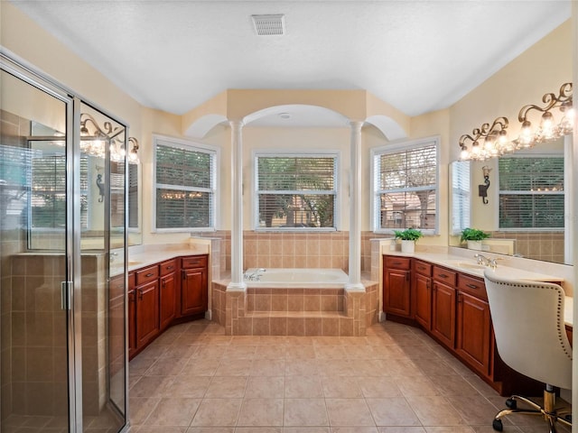 full bathroom featuring visible vents, a garden tub, a stall shower, vanity, and ornate columns