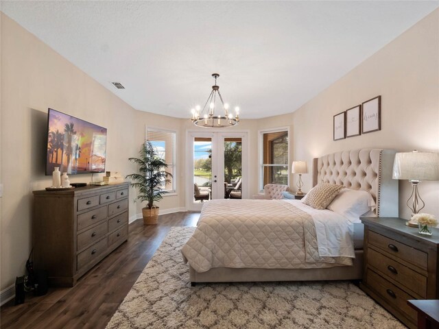 bedroom featuring access to exterior, visible vents, baseboards, an inviting chandelier, and dark wood-style floors