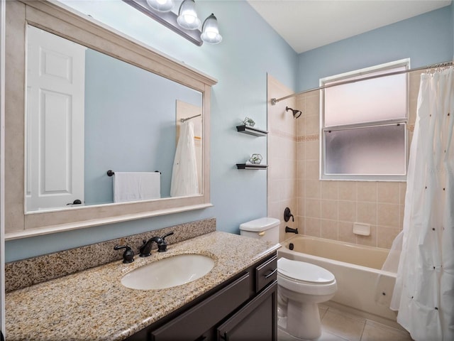 full bath with tile patterned floors, toilet, vanity, and shower / tub combo with curtain