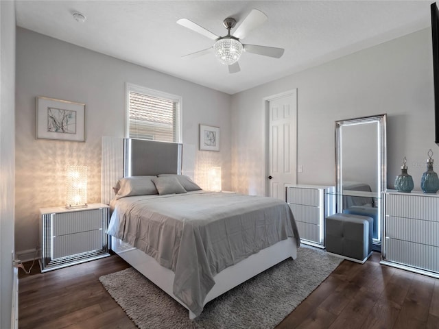 bedroom with ceiling fan and wood finished floors