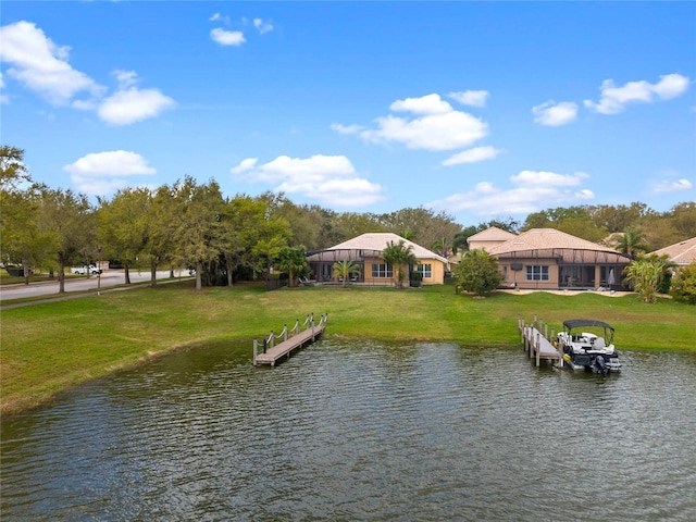 exterior space with a lawn and a water view