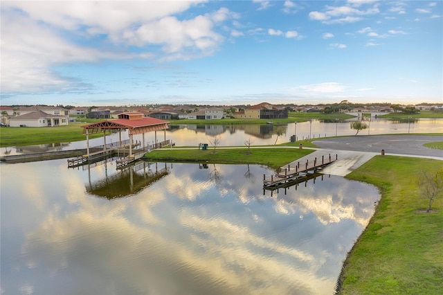 water view featuring a residential view and a dock