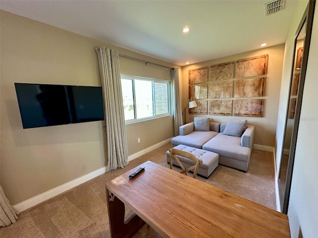 living area with carpet floors, recessed lighting, visible vents, and baseboards