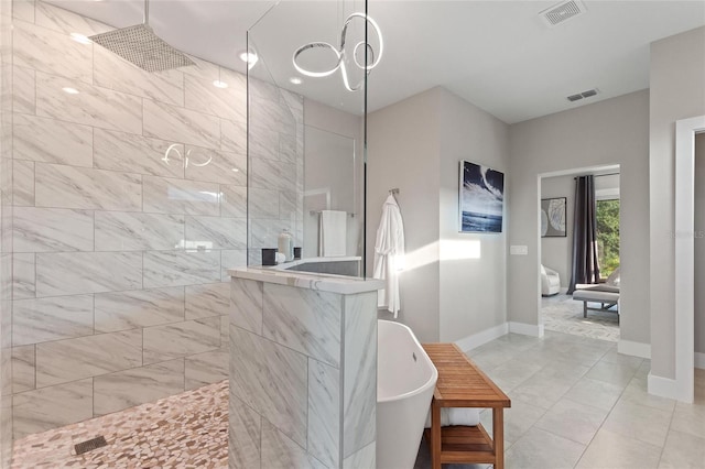 full bath featuring visible vents, a freestanding bath, baseboards, and walk in shower