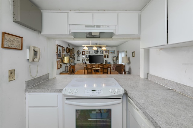 kitchen with light countertops, white range with electric stovetop, and white cabinetry