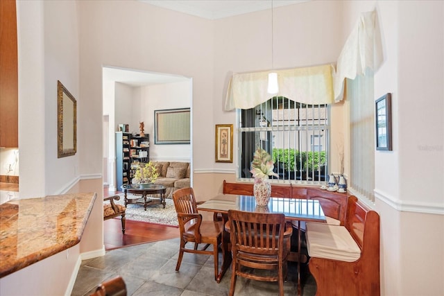 dining room featuring crown molding