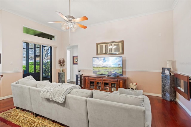 living area featuring wood finished floors and crown molding