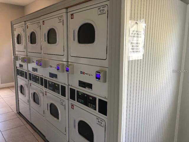 community laundry room with washer and dryer and stacked washer / dryer