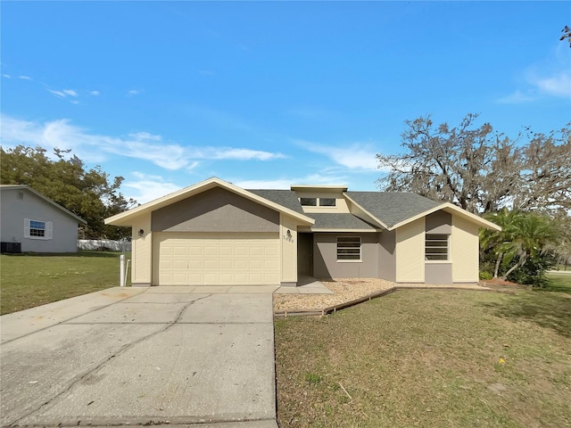 view of front of house with an attached garage, driveway, a front lawn, and stucco siding