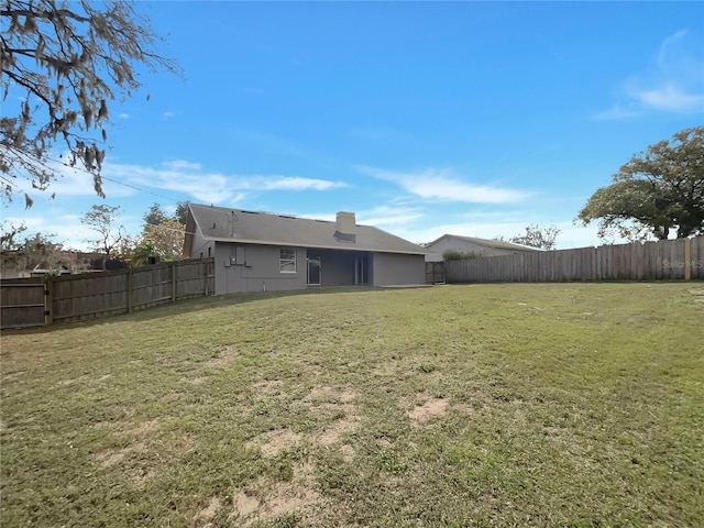 view of yard featuring a fenced backyard