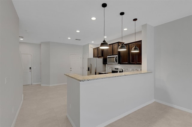 kitchen with appliances with stainless steel finishes, recessed lighting, dark brown cabinetry, and baseboards