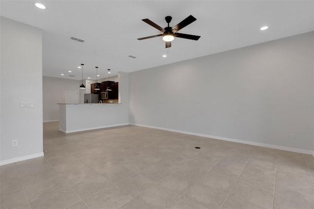 unfurnished living room featuring baseboards, visible vents, a ceiling fan, and recessed lighting