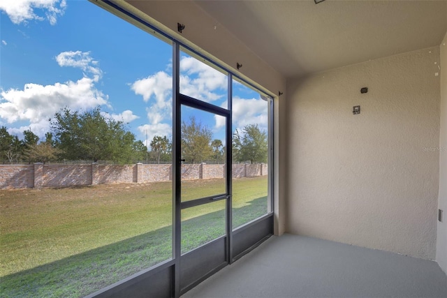 unfurnished sunroom with a wealth of natural light