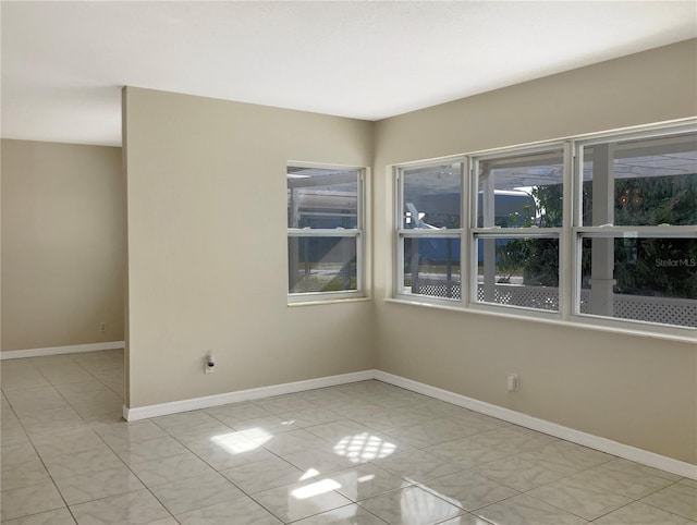 spare room featuring baseboards