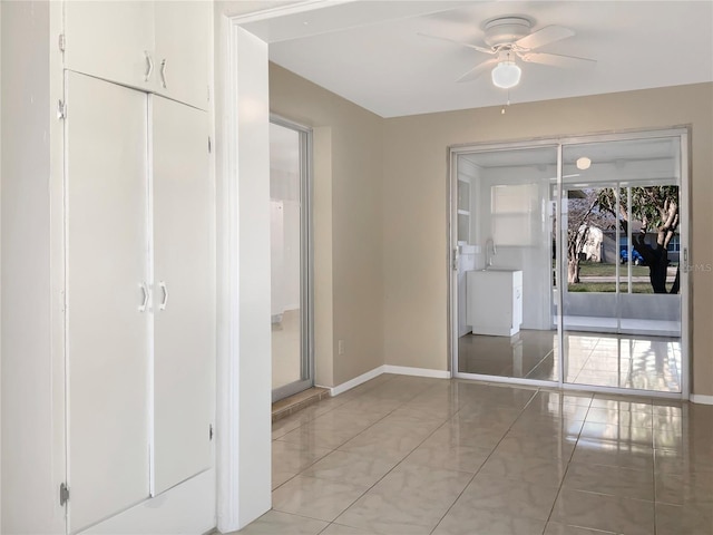 unfurnished bedroom with light tile patterned floors and baseboards