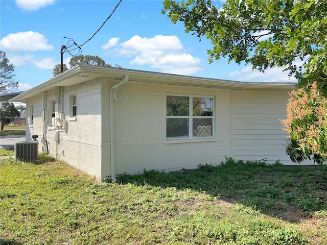 view of home's exterior with central AC unit